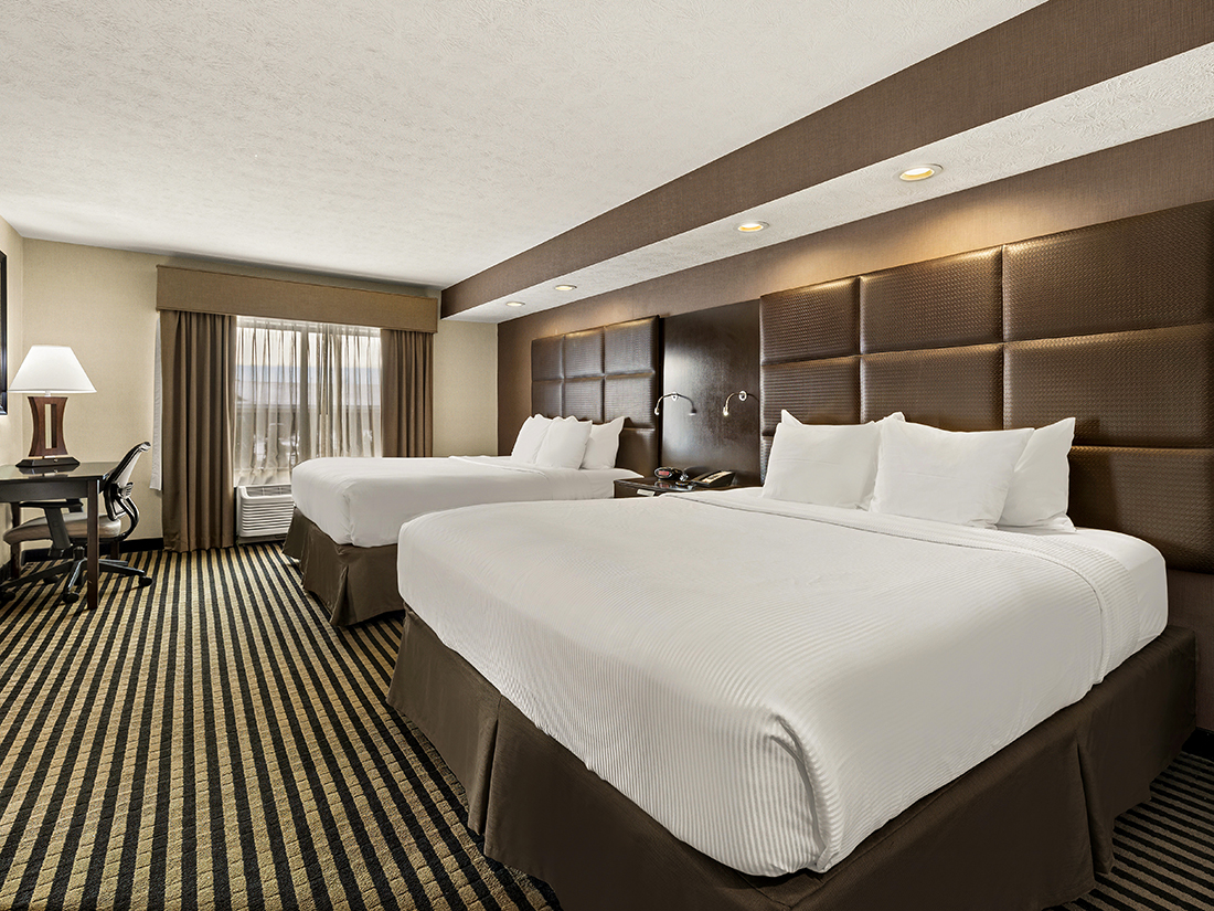 Two king bed suite with fireplace at Sonesta Essential Indianapolis Airport
